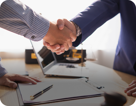 Lawyer shaking hands with client